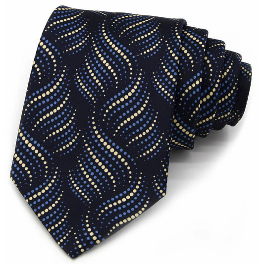 A dark blue men's necktie featuring a flowing wave pattern of light blue and beige dots is tied in a four-in-hand knot on a crisp white button-down shirt.