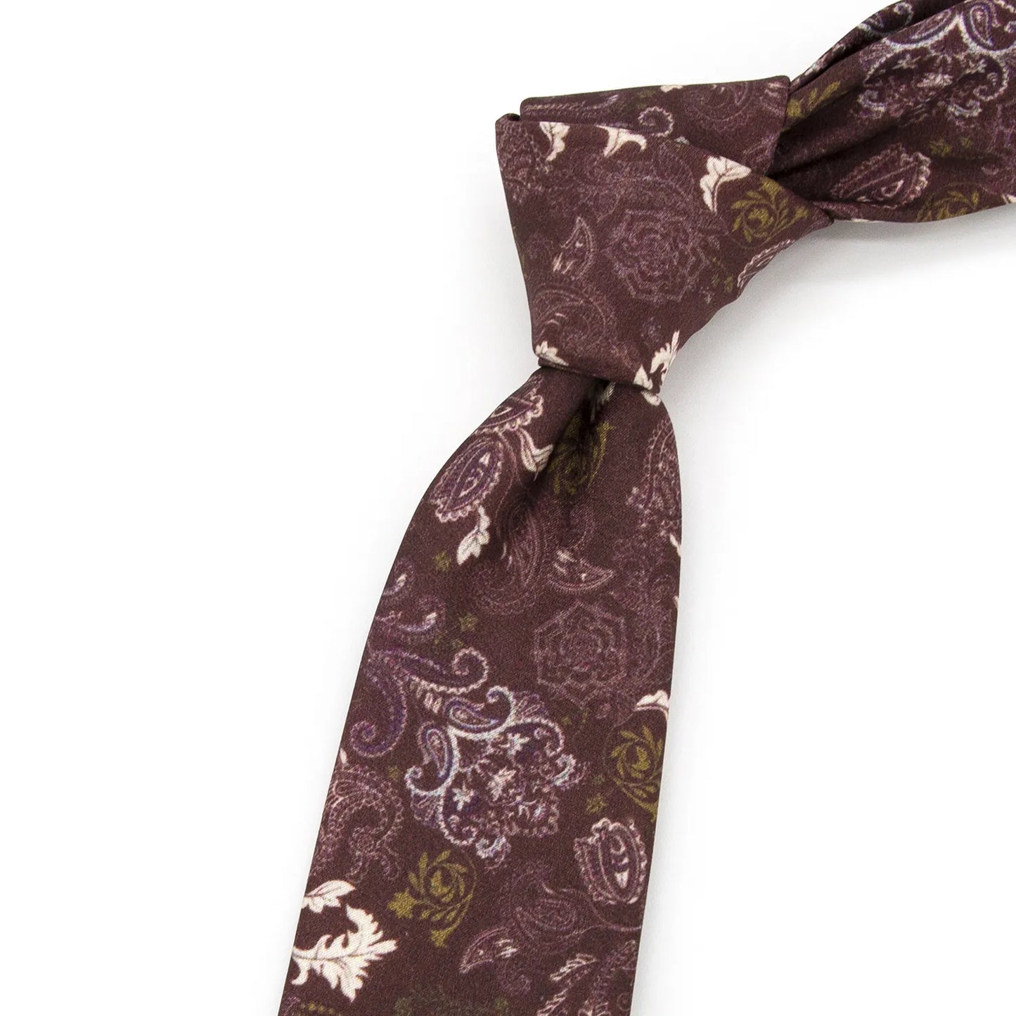 A neatly rolled deep burgundy men's necktie displaying its vintage paisley and floral motifs in beige, lavender, and olive green against a clean white surface.