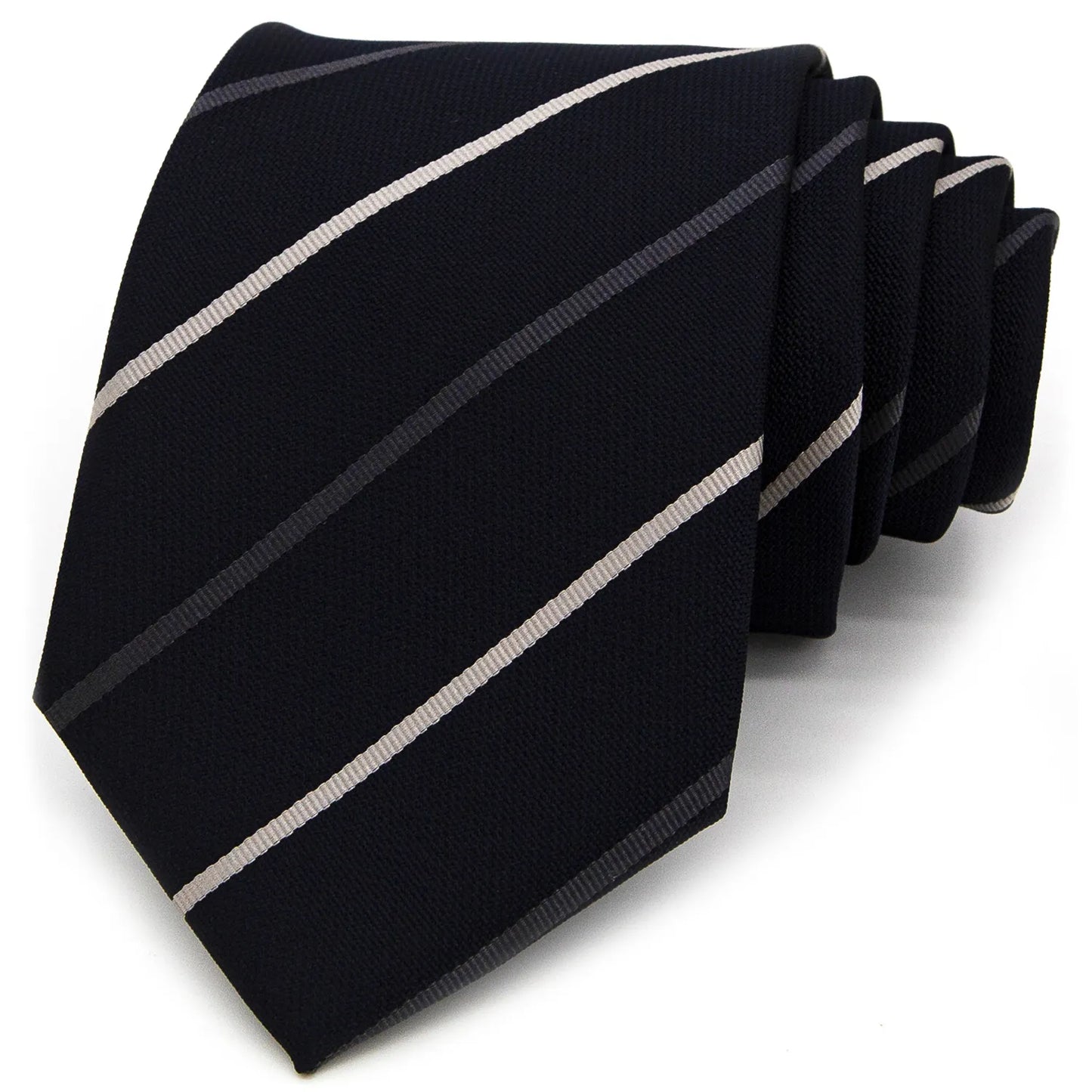 A deep blue men's necktie featuring diagonal stripes in white and grey is tied in a four-in-hand knot on a crisp white button-down shirt, suitable for business and professional attire
