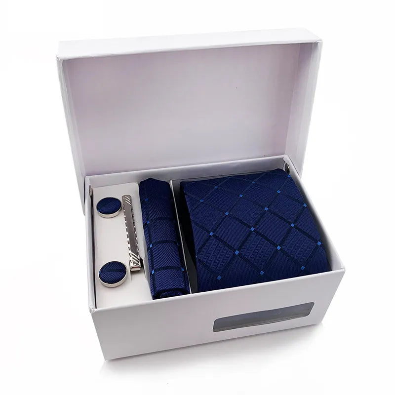 The XueDouLing Tie premium tie set is displayed, showing the elegant deep purple checkered necktie with its matching pocket square and sleek cufflinks, presented neatly as a cohesive accessory package.