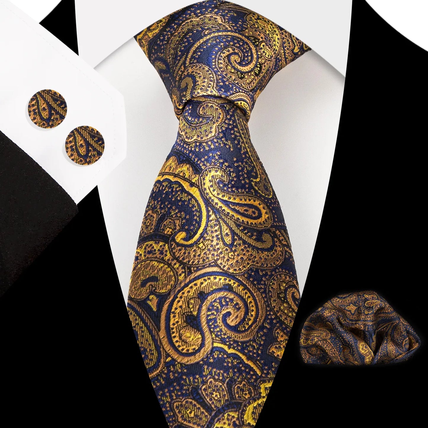 Close-up of a luxurious navy blue and gold paisley silk tie, perfectly knotted, with matching pocket square and cufflinks visible, styled for formal occasions.
