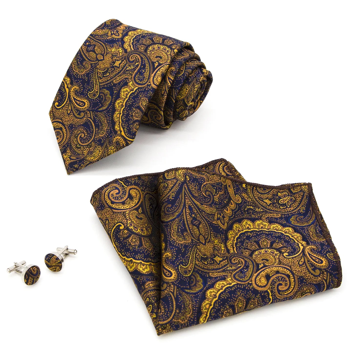 Coordinated set of a rolled navy blue and gold paisley silk tie, folded matching pocket square, and two round cufflinks, all featuring an intricate pattern.