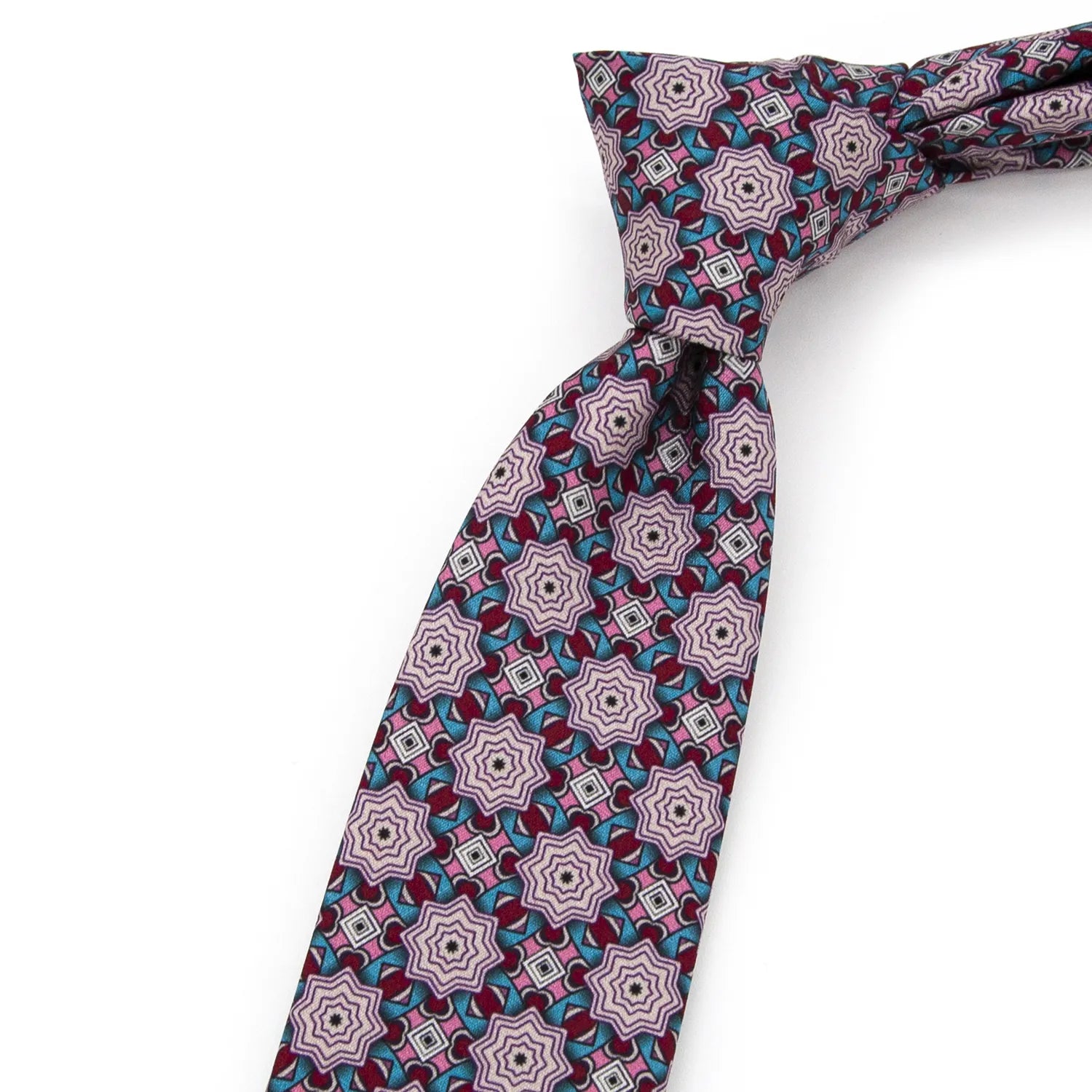 A neatly folded mauve men's necktie displaying its detailed kaleidoscope-like geometric design in pink, burgundy, and light blue against a plain white surface.