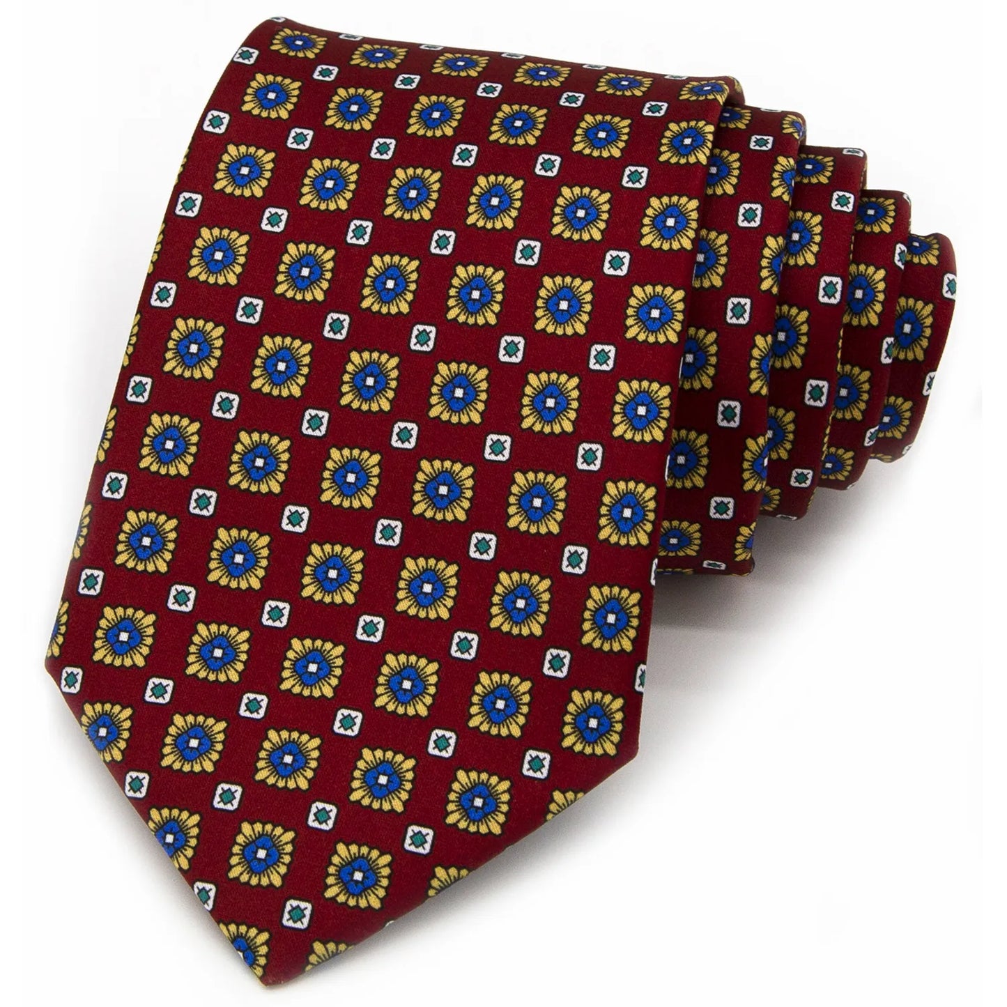 A neatly rolled deep red men's necktie showcasing its classic pattern of small blue and gold flowers with white and green square details against a clean white backdrop.