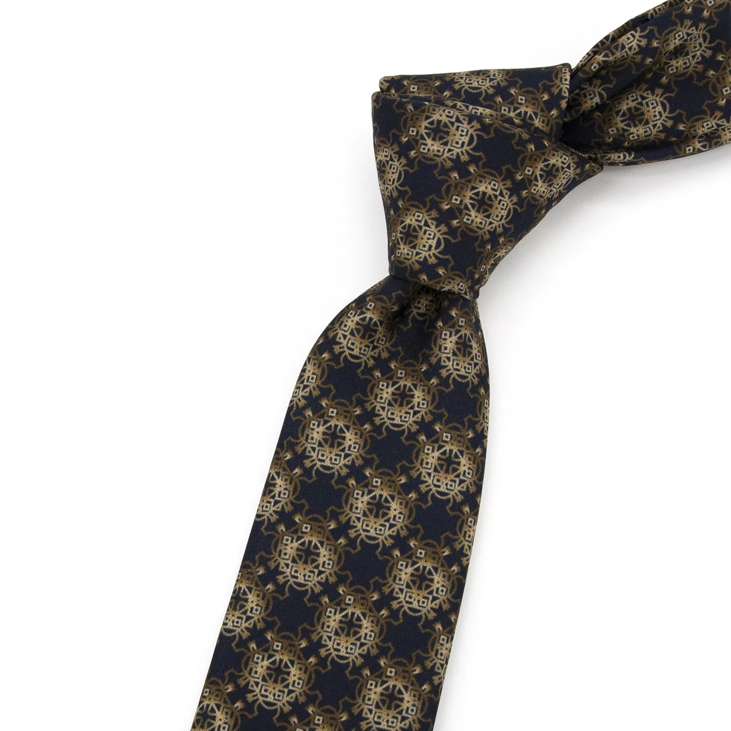 A deep blue men's necktie featuring an intricate golden and brown totem-like geometric pattern is loosely knotted against a white background.