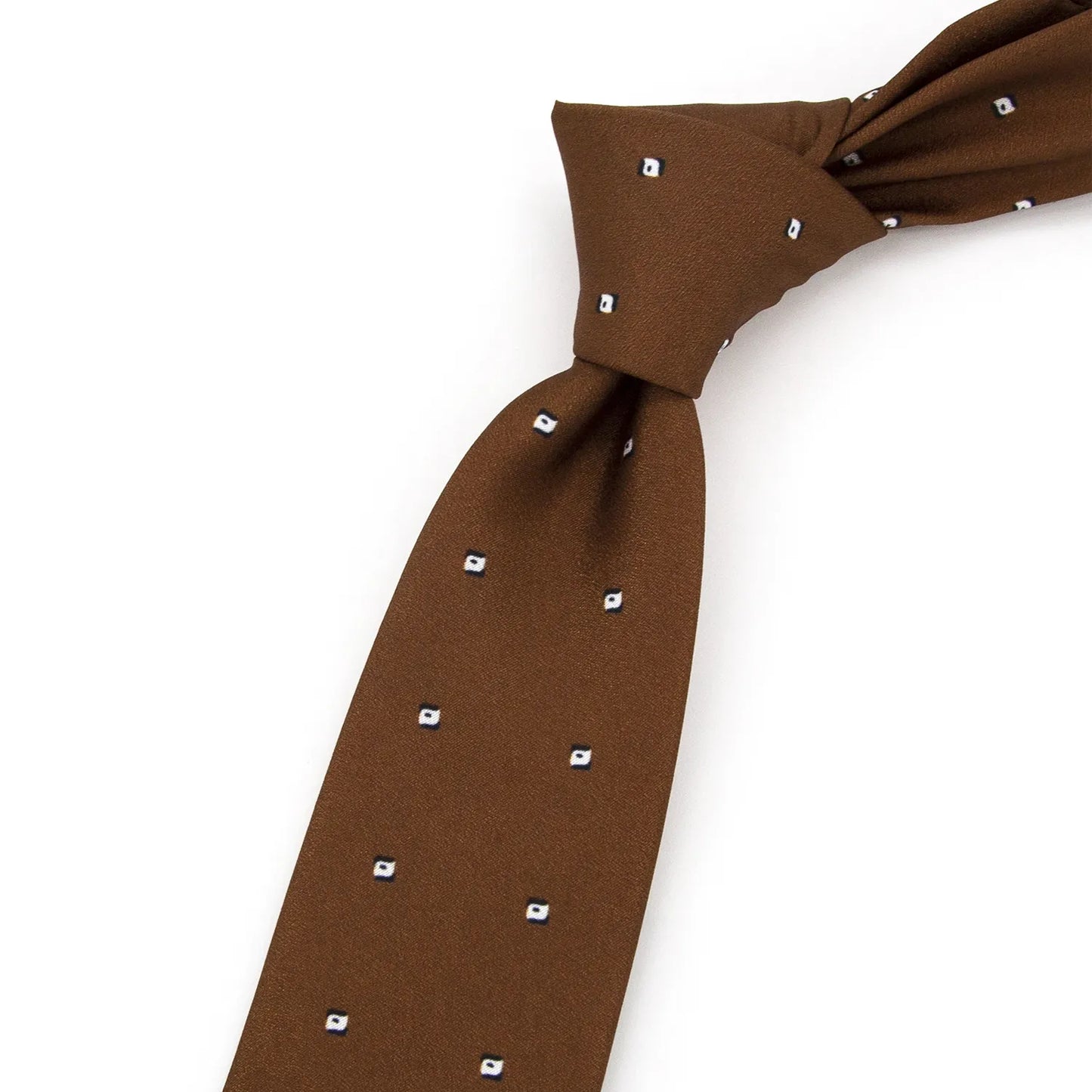 A neatly folded brown men's necktie showcasing its subtle pattern of small white and blue quadrilateral dots against a clean white surface.