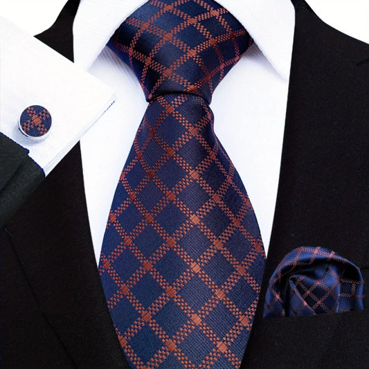 A men's necktie with a blue plaid pattern, paired with a white shirt and black suit, including a matching pocket square and cufflinks.
