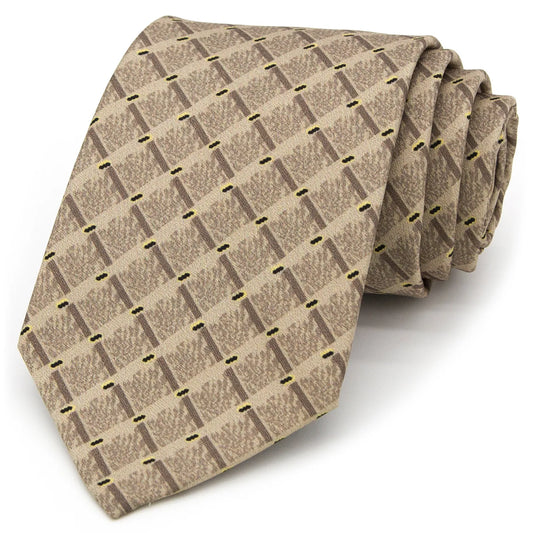 A light brown men's necktie featuring a subtle geometric pattern of dark brown diamonds and yellow dashes is casually knotted against a white background.