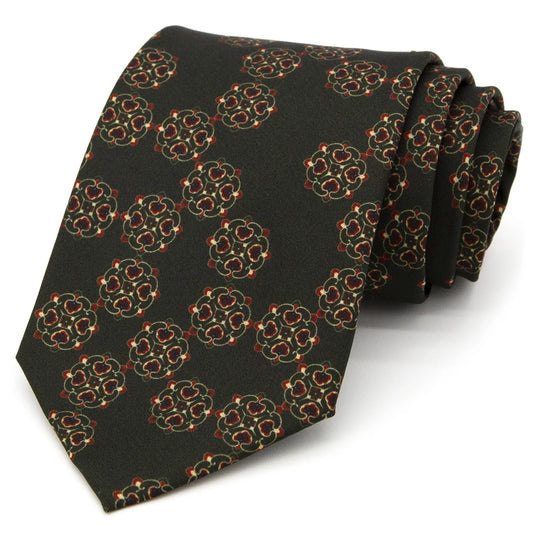 A dark grey-green men's necktie featuring a subtle vintage floral pattern in red, beige, and brown is casually knotted against a white background.
