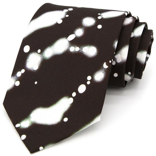 A dark brown men's necktie featuring an abstract white and light green ink wash style pattern is casually knotted against a white background.