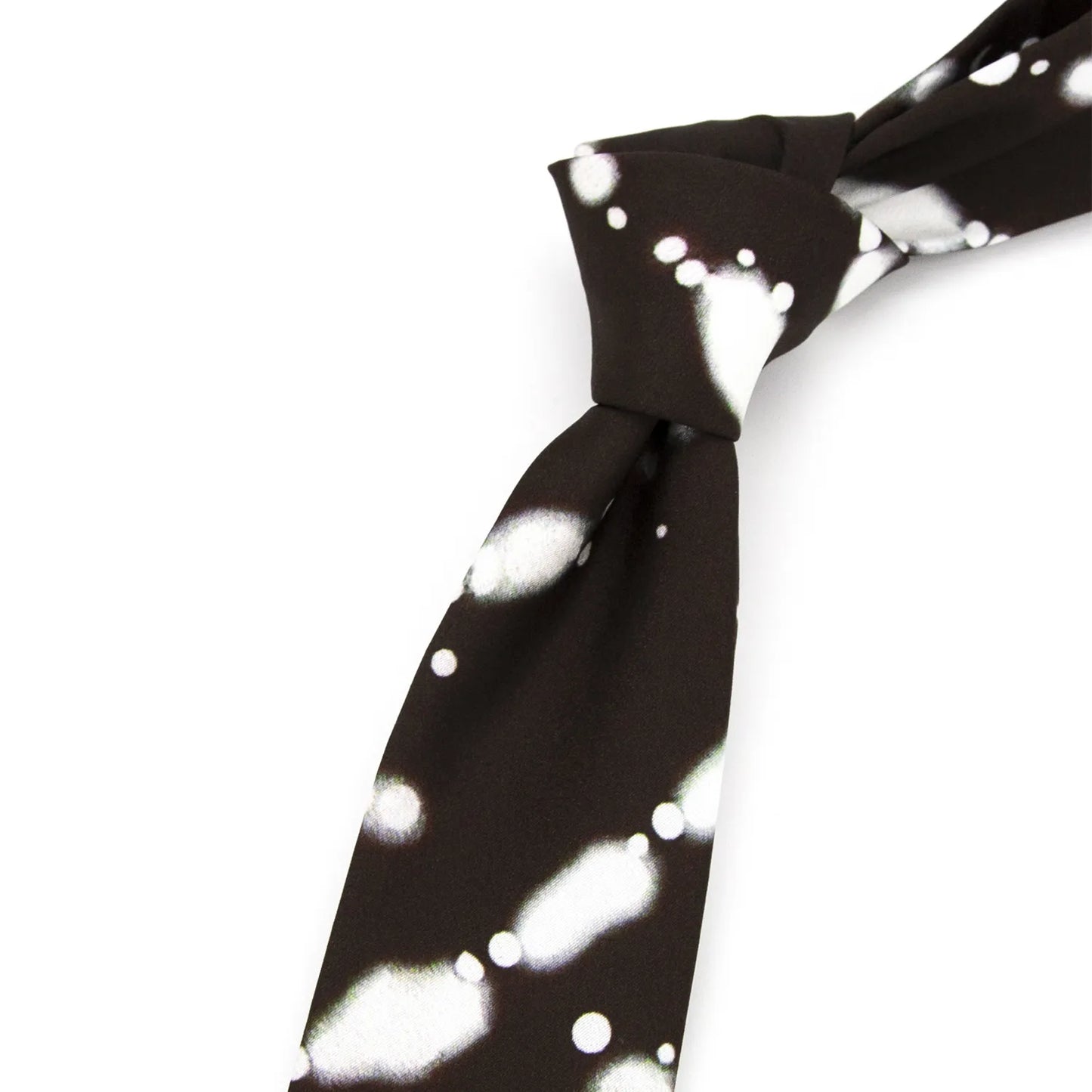 A neatly rolled dark brown men's necktie displaying its abstract white and light green ink wash style pattern against a clean white surface.