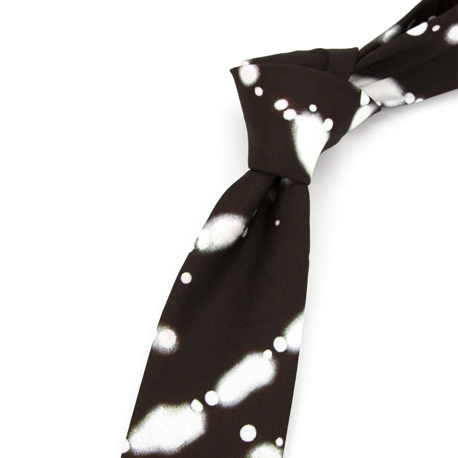A neatly rolled dark brown men's necktie displaying its abstract white and light green ink wash style pattern against a clean white surface.