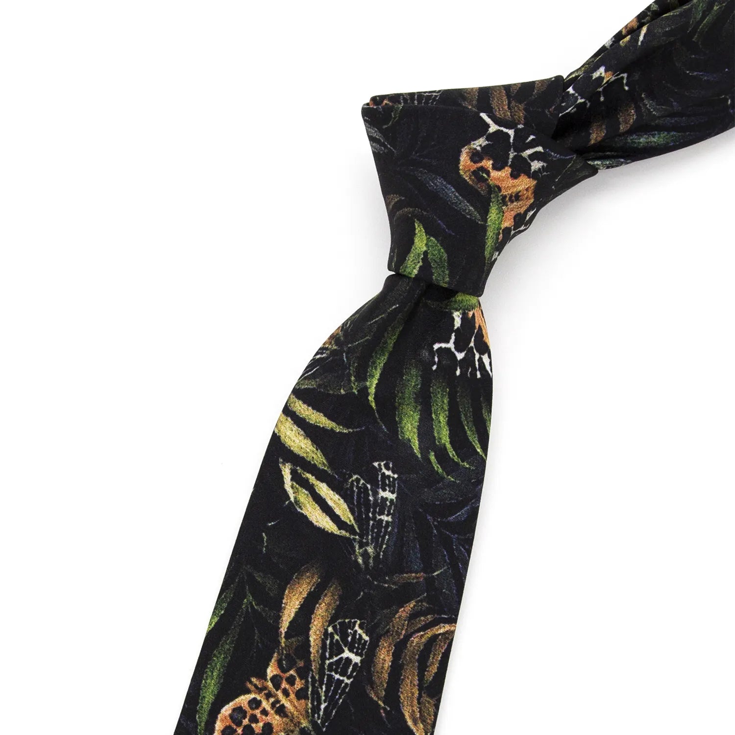 A neatly rolled dark black men's necktie displaying its unique butterfly and leaf pattern in brown, green, and beige against a clean white surface.