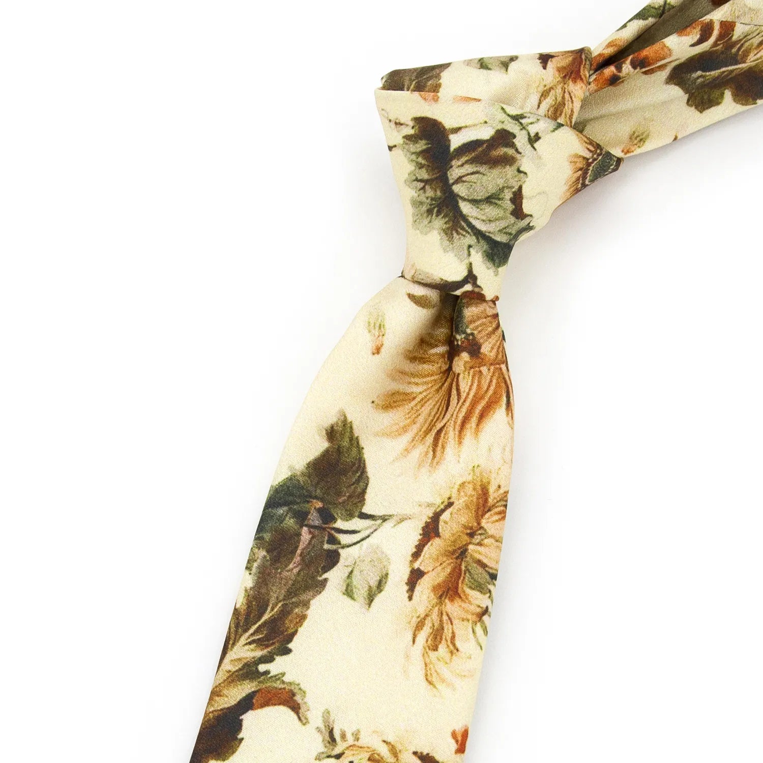 A neatly rolled cream-colored men's necktie displaying its vintage floral pattern with brown, orange, and green blooms and foliage against a clean white surface.