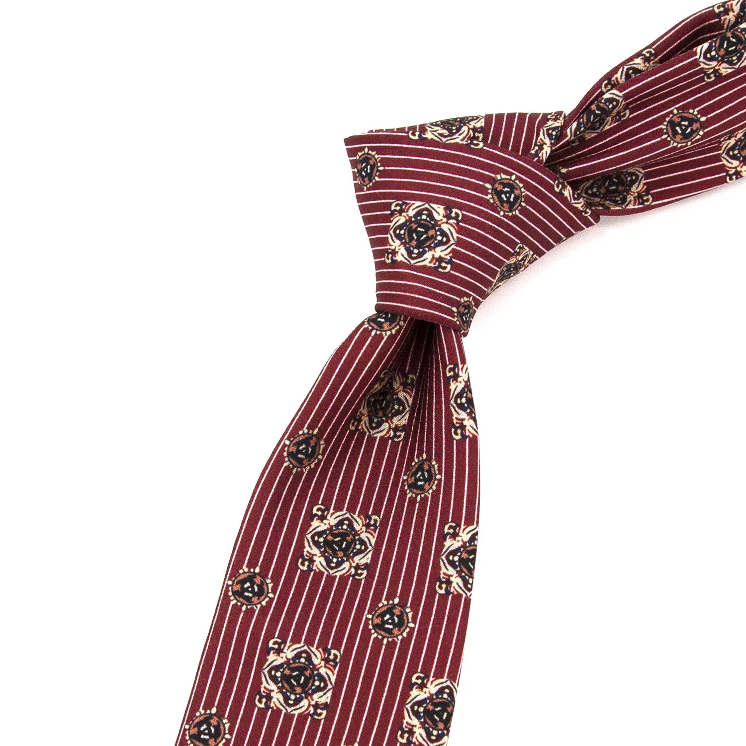 A neatly tied rich wine red men's necktie with white polka dots, shown on a white collared shirt, suggesting a sharp, festive, and sophisticated look.