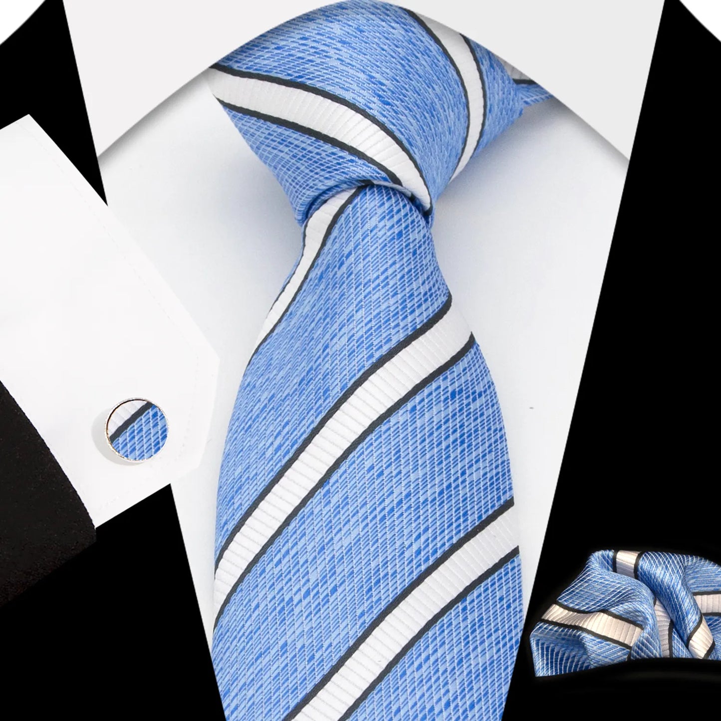 A complete men's tie gift box set, featuring a refreshing sky blue necktie with a subtle pattern of small dark blue and white geometric diamonds, a perfectly matched pocket square, and a pair of sleek silver-toned cufflinks, elegantly presented for a sophisticated yet relaxed professional.