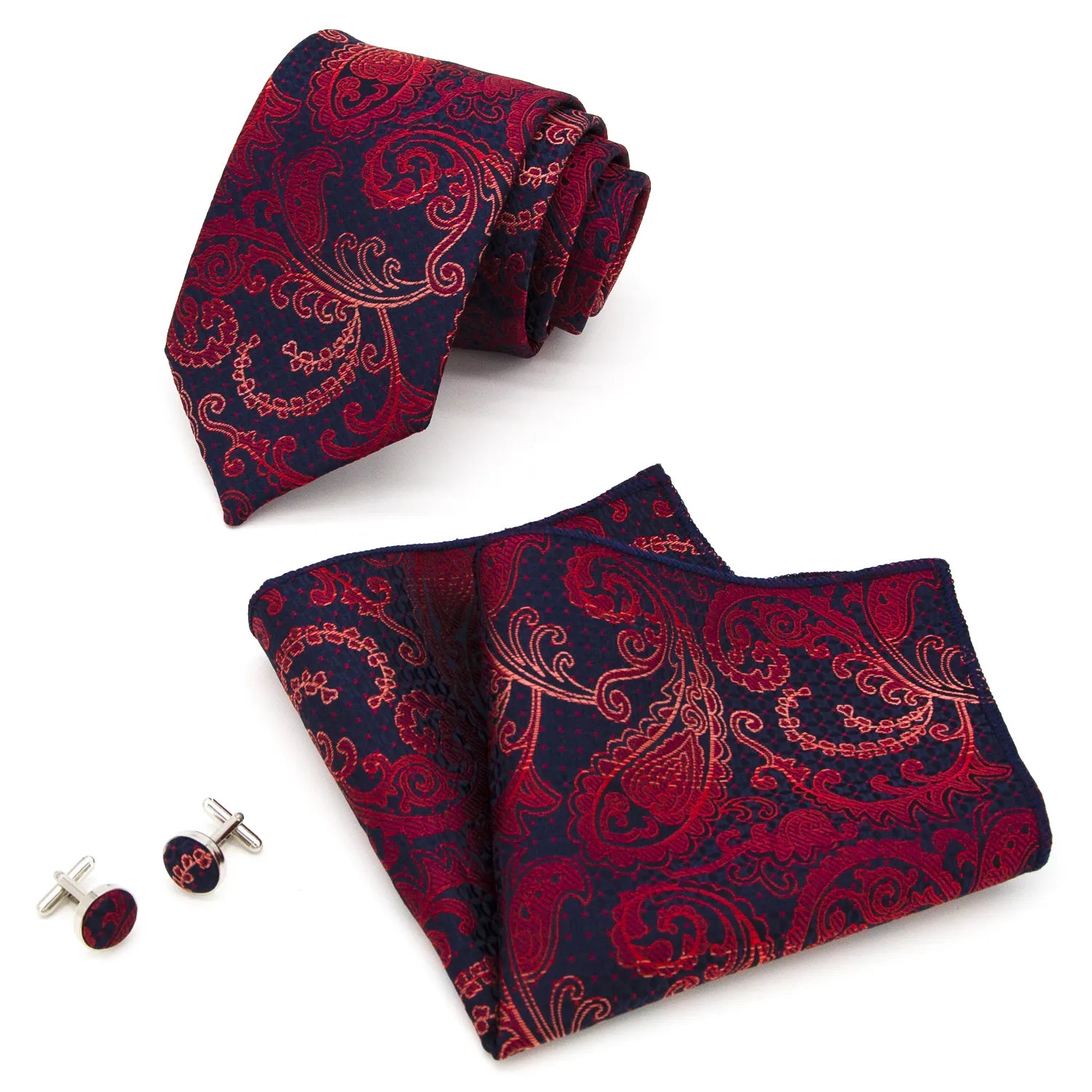 Complete set featuring a rolled red and navy blue paisley polyester tie, a folded matching pocket square, and two silver cufflinks with a red and navy inlay, displayed against a white background.
